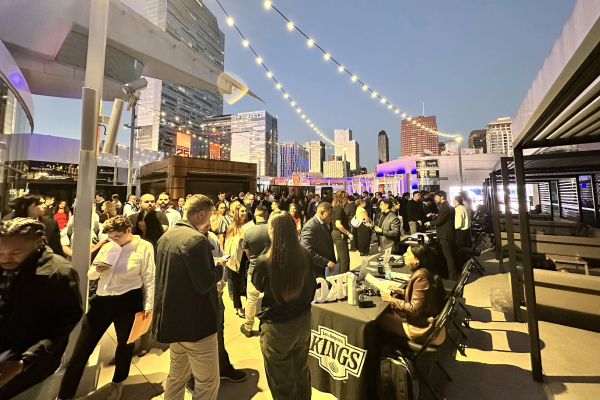 Outdoor rooftop networking event with the Sacramento Kings at dusk
