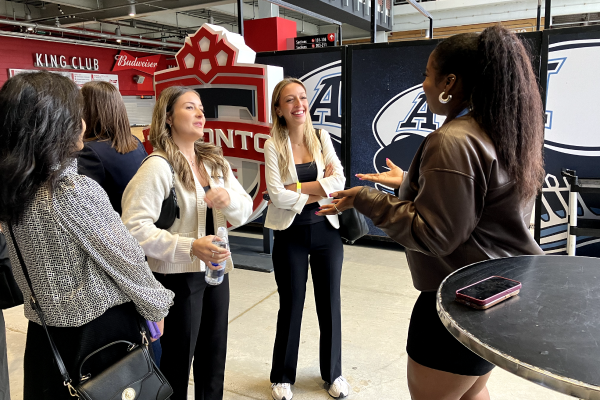Attendees networking at a Toronto Argonauts career event