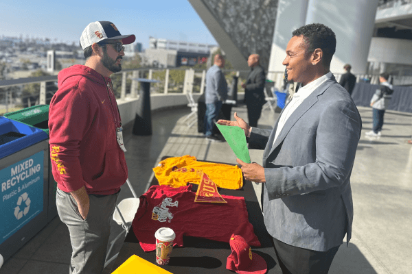 Two attendees networking at an outdoor career event