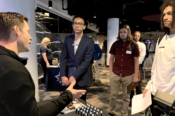 Employer speaking with candidates at a Cleveland Cavaliers career fair