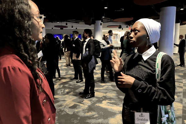 Two attendees conversing at a Cleveland Cavaliers networking event