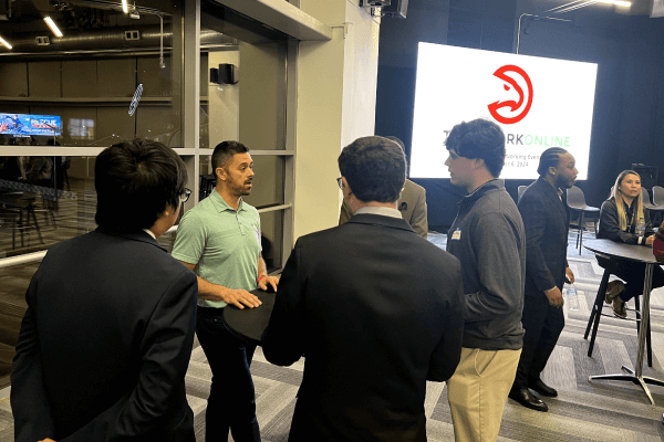 Group of attendees mingling at the TeamWork Online Executive Networking Event